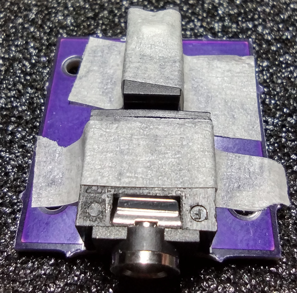 Electrical components secured with tape