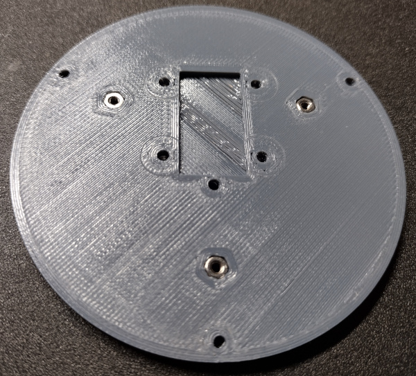 Base mounting holes with captive nuts installed